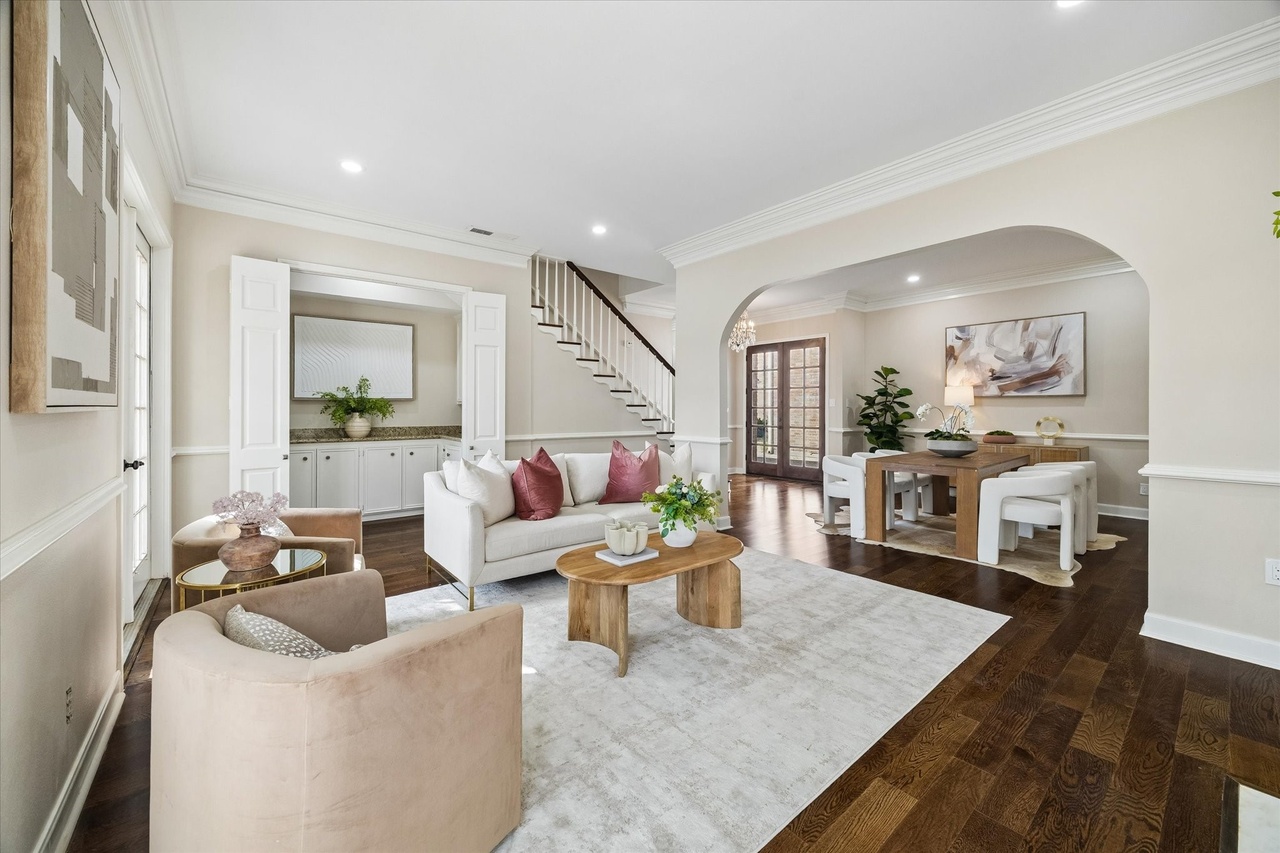 Living and dining spaces with hardwood floors and painted walls